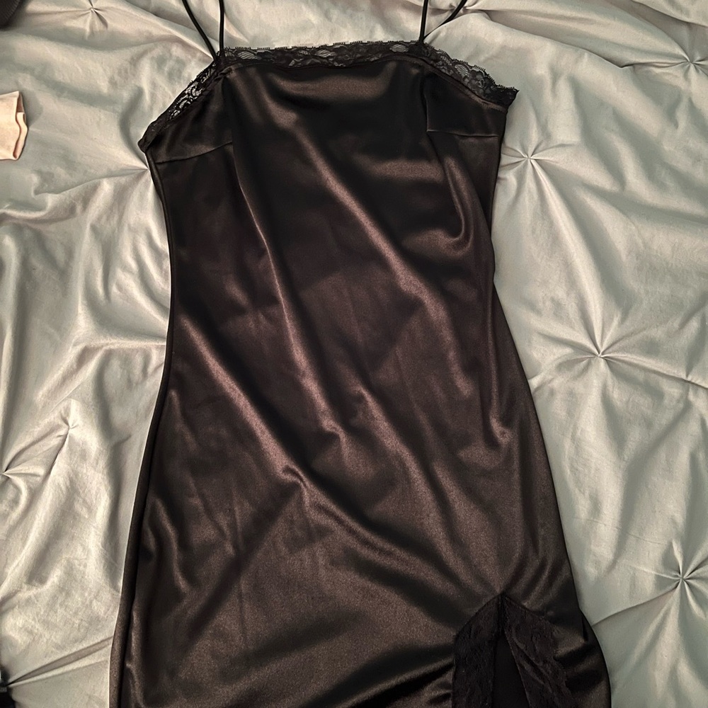 Black dress with lace detail. Size medium and has been worn once.